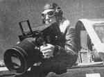 An aerial photographer with a descendant design of the Fairchild K-20 aerial camera.