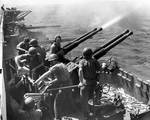 Gunnery practice with 40-mm Bofors MK 12 anti-aircraft guns aboard Hornet while her aircraft raided Japan, 16 Feb 1945